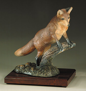 "Red Alert" Fox standing on log